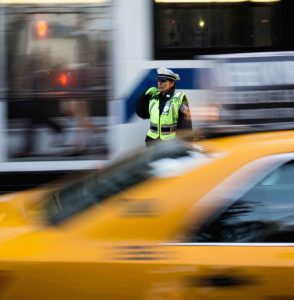 Photo by emil-bruckner-568934-unsplash CROP small Police officer in traffic